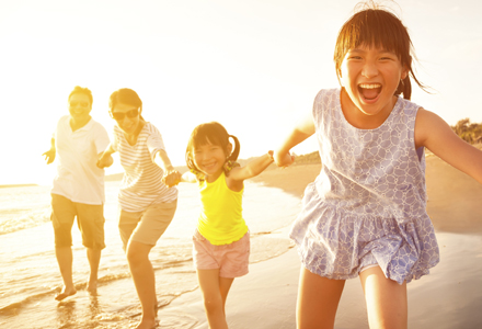 Family having fun at the beach