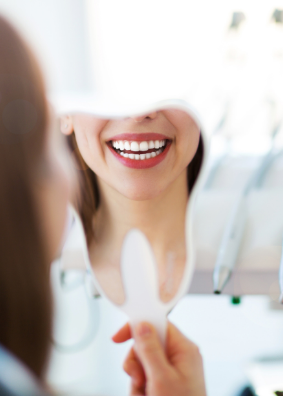 Woman smiling after cosmetic dental work